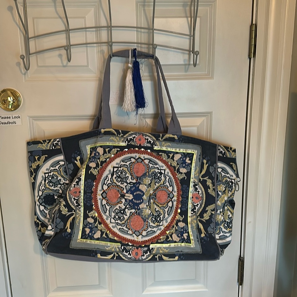 Fabulous cotton, oversized, duffel with inside zipper pocket.